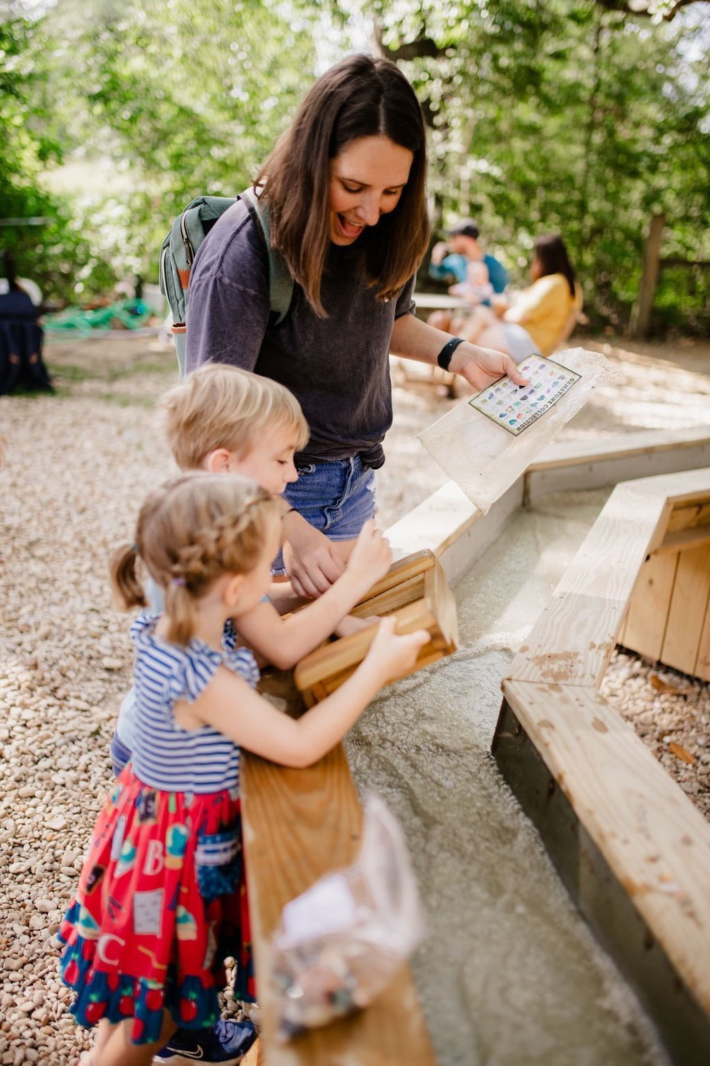 A family identifying finds against the gemstone chart